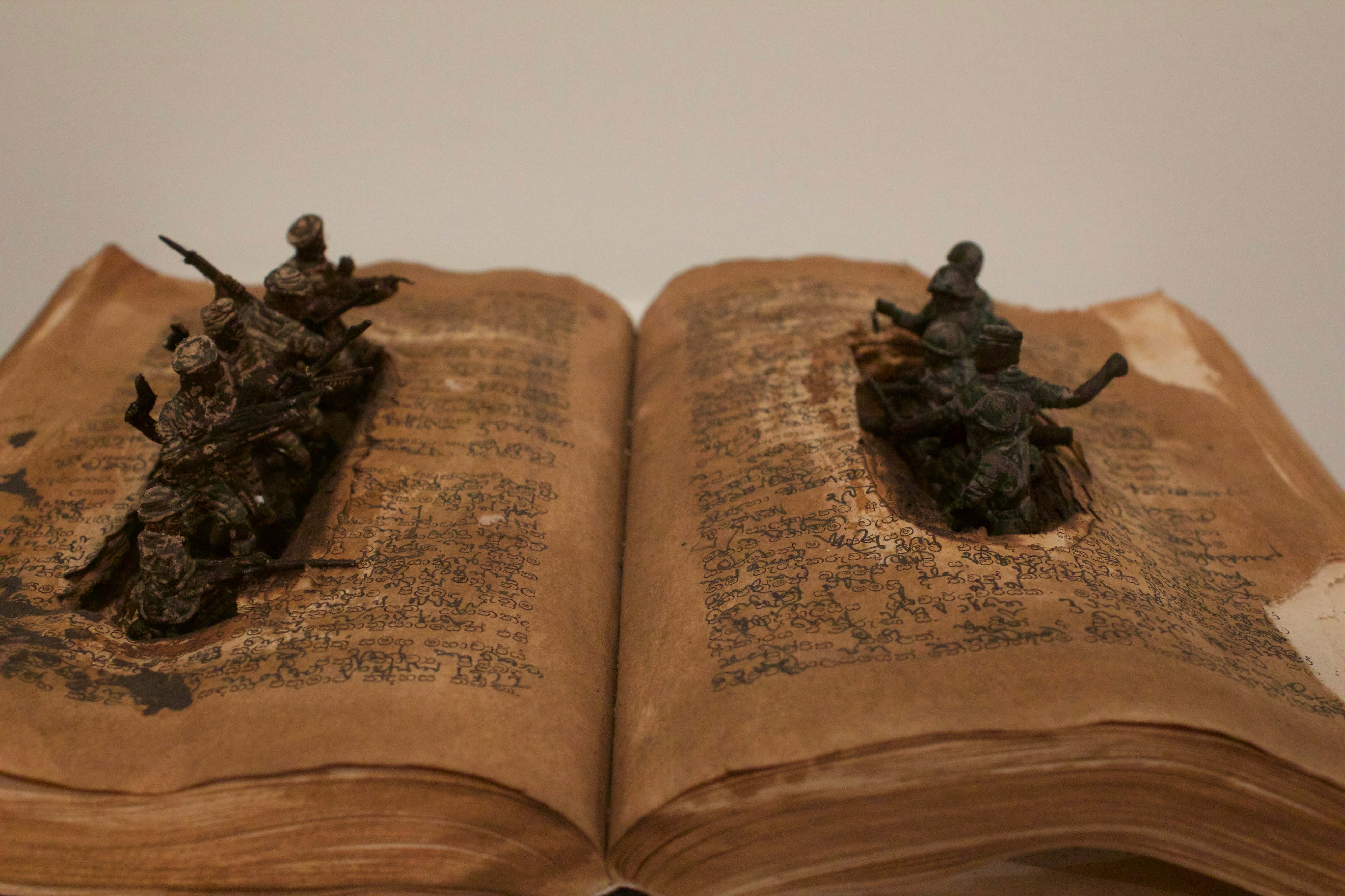 Kingsley Gunatillake, book art, Used books and toy soldiers
